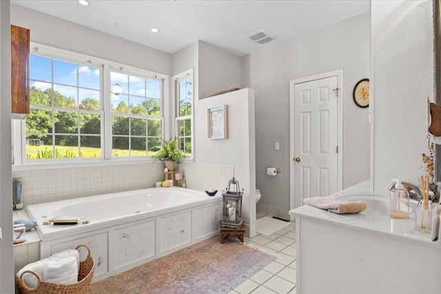 495 Baker Rd, Dickson, TN 37055 - full bath featuring toilet, tile patterned flooring, a garden tub, and recessed lighting