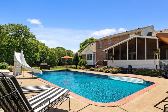 495 Baker Rd, Dickson, TN 37055 - outdoor pool with a water slide, a sunroom, and a patio