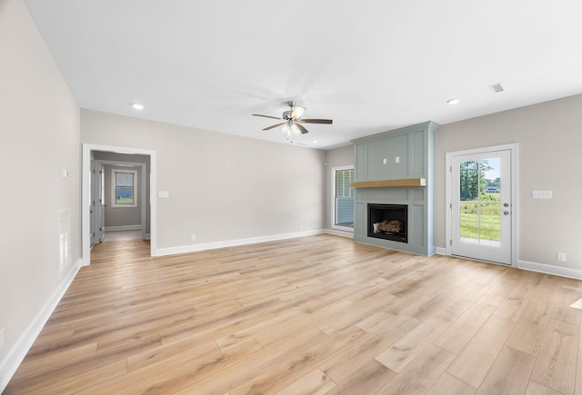 1456 Sango Commons Way, Clarksville, TN 37043 - unfurnished living room featuring a ceiling fan, a fireplace, light wood-style flooring, baseboards, and recessed lighting