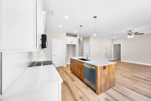 1456 Sango Commons Way, Clarksville, TN 37043 - kitchen with dishwasher, a sink, light wood-type flooring, a ceiling fan, and a kitchen island with sink