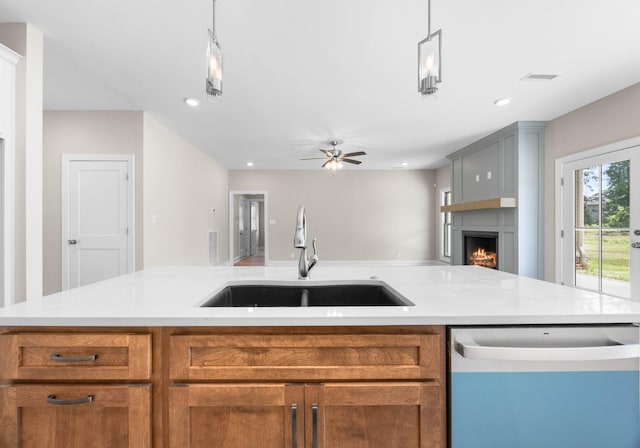 1456 Sango Commons Way, Clarksville, TN 37043 - kitchen with dishwashing machine, open floor plan, light countertops, brown cabinets, and recessed lighting