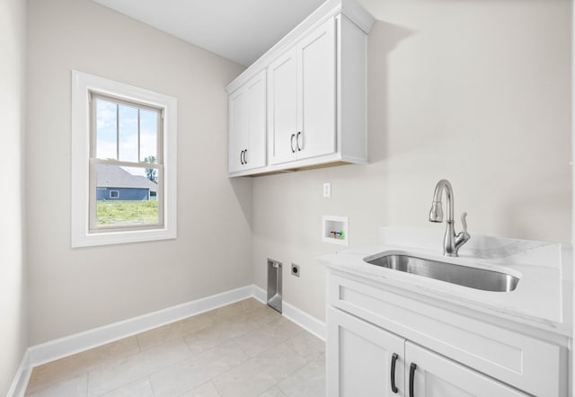 1456 Sango Commons Way, Clarksville, TN 37043 - laundry room featuring electric dryer hookup, washer hookup, cabinet space, and baseboards
