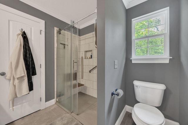27 Lightning Bug Ln, Sewanee, TN 37375 - bathroom with ornamental molding, a shower stall, baseboards, and toilet