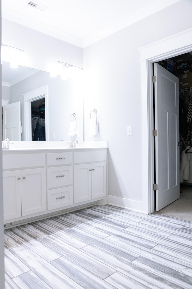 3303 Hampton Turner Dr, Murfreesboro, TN 37128 - full bath featuring wood finished floors, a spacious closet, double vanity, and ornamental molding