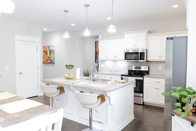 3303 Hampton Turner Dr, Murfreesboro, TN 37128 - kitchen with stainless steel appliances, a sink, dark wood-style flooring, tasteful backsplash, and white cabinetry