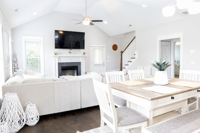 3303 Hampton Turner Dr, Murfreesboro, TN 37128 - dining area with ceiling fan, vaulted ceiling, stairway, dark wood-style floors, and a tile fireplace