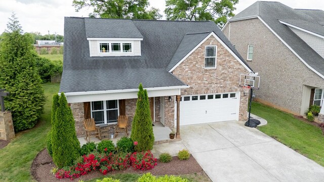 3303 Hampton Turner Dr, Murfreesboro, TN 37128 - view of front facade featuring covered porch, concrete driveway, roof with shingles, a front lawn, and stone siding