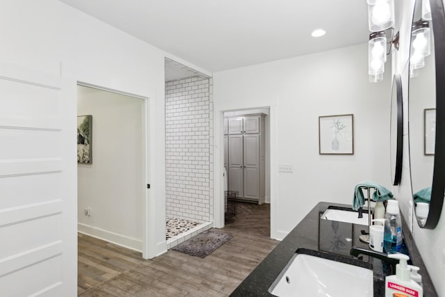 1930 Williams Rd, Lafayette, TN 37083 - full bath featuring wood finished floors, a shower stall, double vanity, baseboards, and recessed lighting