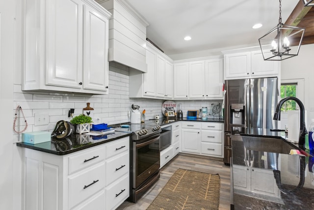 1930 Williams Rd, Lafayette, TN 37083 - kitchen with stainless steel appliances, premium range hood, a chandelier, white cabinets, and recessed lighting
