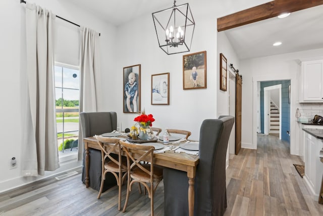 1930 Williams Rd, Lafayette, TN 37083 - dining area featuring a barn door, light wood finished floors, recessed lighting, a chandelier, and stairway