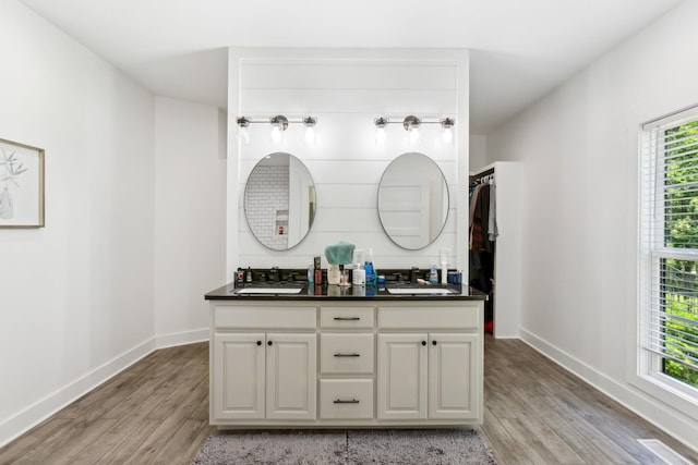 1930 Williams Rd, Lafayette, TN 37083 - bathroom featuring wood finished floors, double vanity, and baseboards
