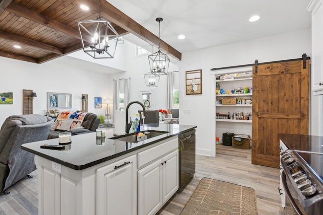 1930 Williams Rd, Lafayette, TN 37083 - kitchen featuring a sink, a chandelier, stainless steel range, dark countertops, and open floor plan