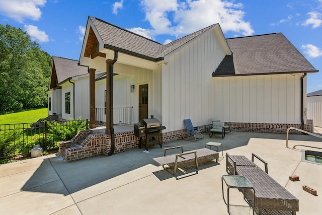 1930 Williams Rd, Lafayette, TN 37083 - back of house featuring board and batten siding, roof with shingles, a patio, and outdoor lounge area