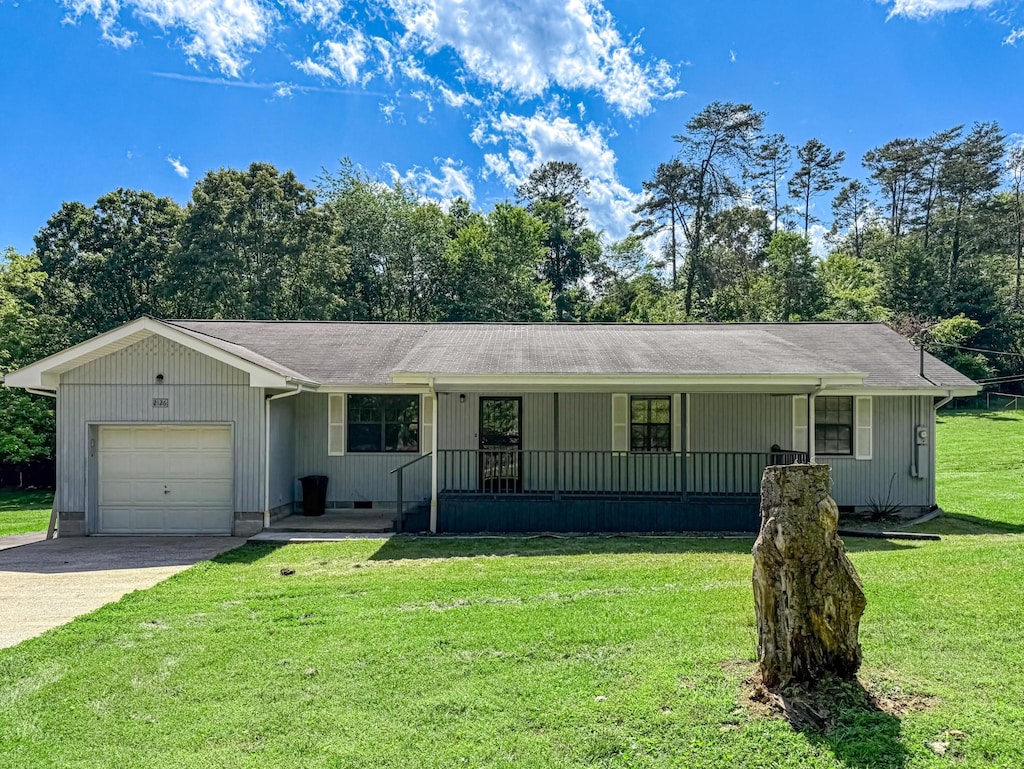 2126 Millard Rd, Soddy Daisy, TN 37379 - ranch-style home with an attached garage, covered porch, a front yard, and driveway