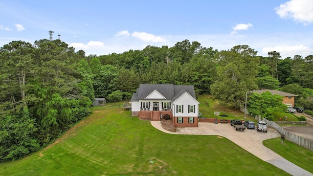 view from above of property with a forest