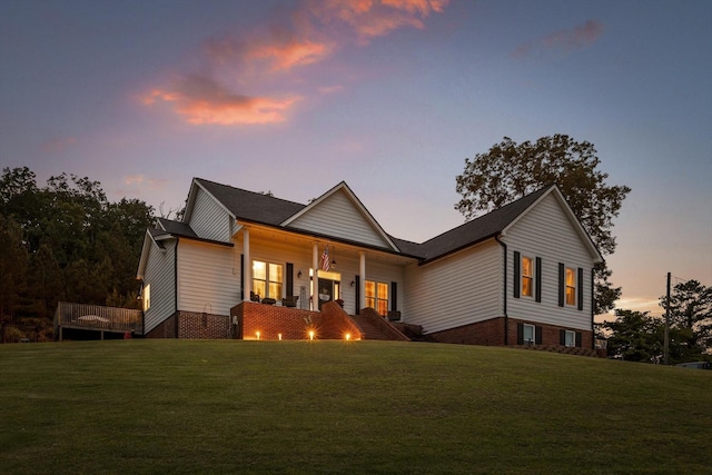 view of front of home featuring a lawn and a porch