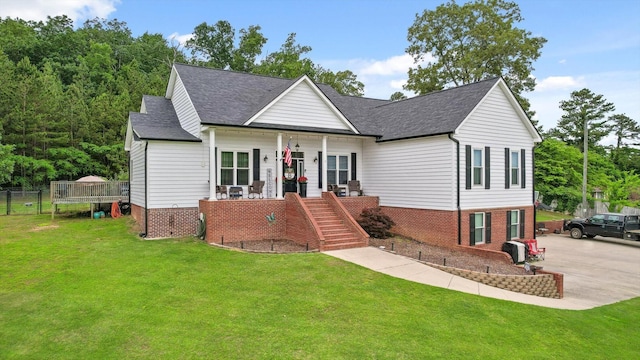 view of front of house with a porch, stairway, and a shingled roof
