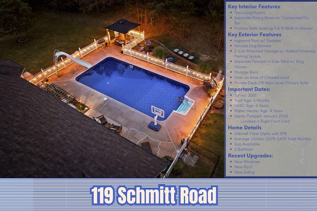 view of swimming pool featuring a water slide, a gazebo, and a patio