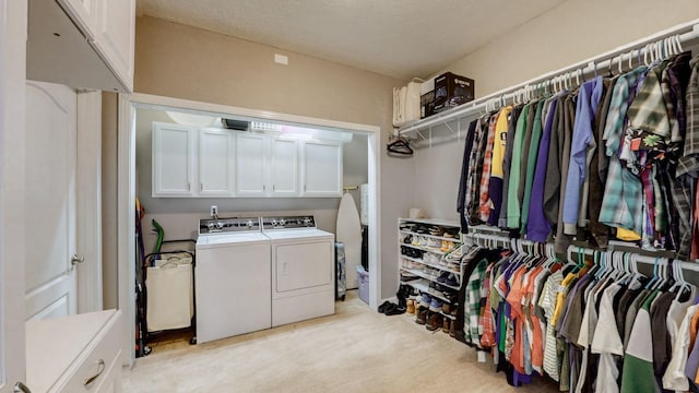 203 Ha Le Koa Ct, Smyrna, TN 37167 - laundry area featuring separate washer and dryer, light colored carpet, and cabinet space