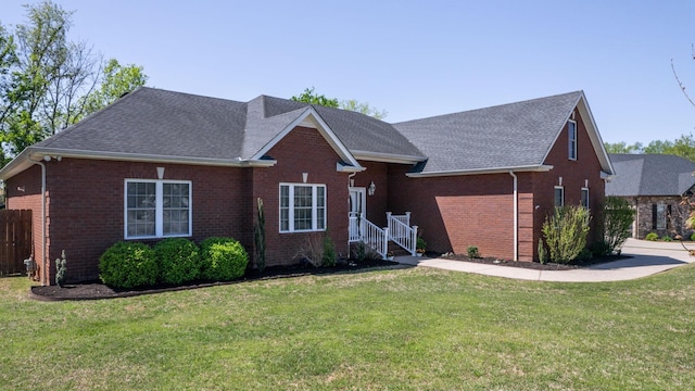 203 Ha Le Koa Ct, Smyrna, TN 37167 - view of front of house with brick siding, roof with shingles, and a front yard