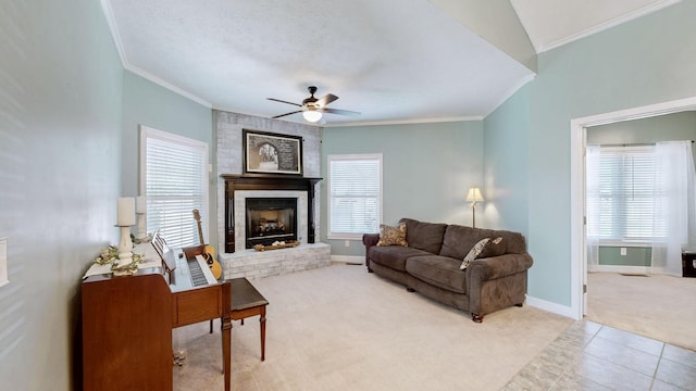 203 Ha Le Koa Ct, Smyrna, TN 37167 - living room featuring light colored carpet, crown molding, ceiling fan, a brick fireplace, and baseboards