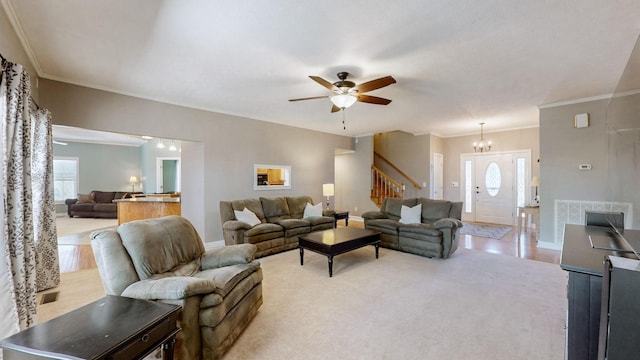 203 Ha Le Koa Ct, Smyrna, TN 37167 - living room featuring stairs, crown molding, a ceiling fan, baseboards, and a chandelier