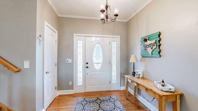 203 Ha Le Koa Ct, Smyrna, TN 37167 - foyer entrance with wood finished floors, ornamental molding, a chandelier, and baseboards