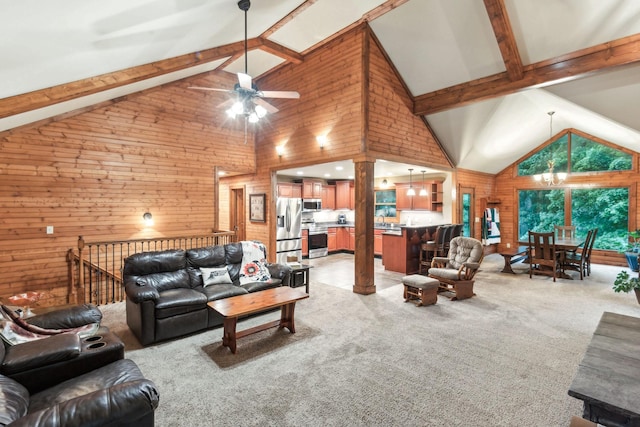 4455 Tarsus Rd, Palmyra, TN 37142 - living room with a ceiling fan, wooden walls, light colored carpet, beamed ceiling, and high vaulted ceiling