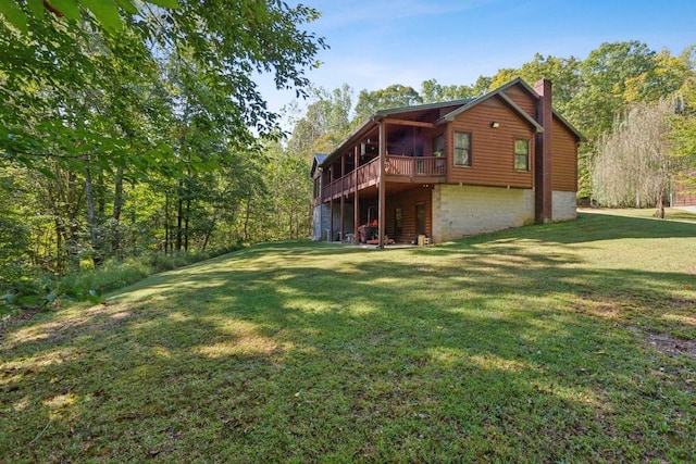 4455 Tarsus Rd, Palmyra, TN 37142 - back of house featuring a chimney, a yard, and a deck