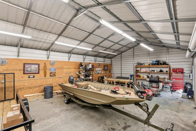 4455 Tarsus Rd, Palmyra, TN 37142 - garage with metal wall and a workshop area