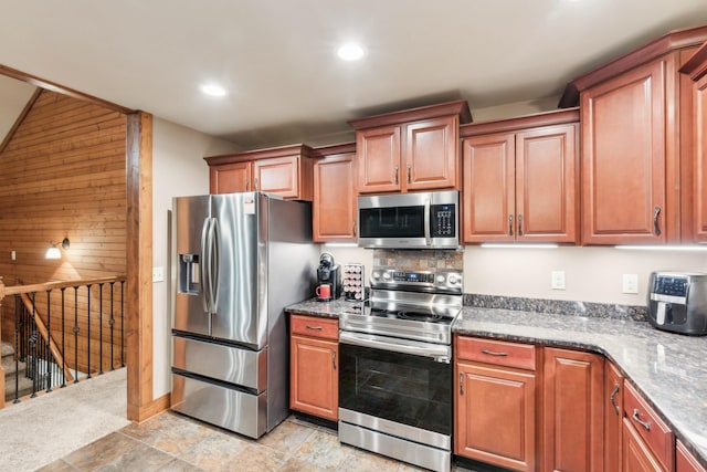 4455 Tarsus Rd, Palmyra, TN 37142 - kitchen with stainless steel appliances, recessed lighting, and brown cabinets