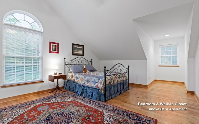 2385 Clear Brooks Dr, Signal Mountain, TN 37377 - bedroom featuring wood finished floors, multiple windows, vaulted ceiling, and baseboards