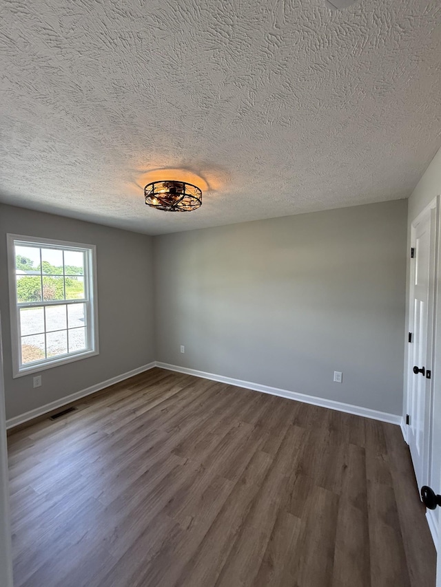 1331 Springplace Rd, Lewisburg, TN 37091 - empty room with a textured ceiling, dark wood-style floors, and baseboards