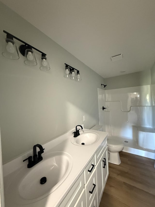 1331 Springplace Rd, Lewisburg, TN 37091 - full bath featuring a walk in shower, toilet, wood finished floors, and double vanity