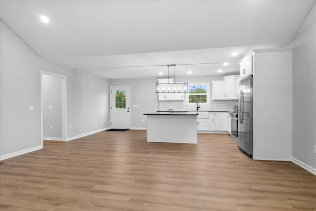 1331 Springplace Rd, Lewisburg, TN 37091 - kitchen featuring freestanding refrigerator, open floor plan, recessed lighting, white cabinets, and light wood-style flooring