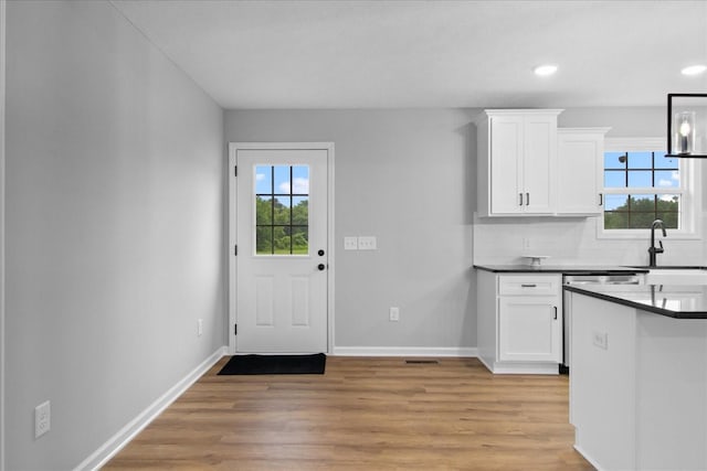 1331 Springplace Rd, Lewisburg, TN 37091 - kitchen with healthy amount of natural light, light wood-style floors, white cabinetry, and recessed lighting