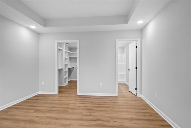 1331 Springplace Rd, Lewisburg, TN 37091 - unfurnished bedroom featuring recessed lighting, a walk in closet, light wood-type flooring, and a closet