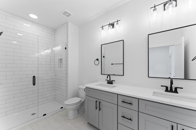714 N Dupont Ave, Madison, TN 37115 - full bathroom featuring toilet, a stall shower, and double vanity