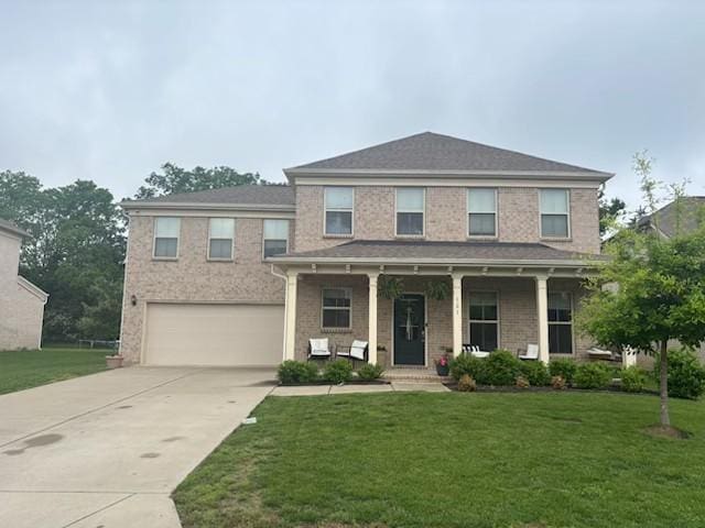 321 Union Pier Dr, Mount Juliet, TN 37122 - view of front of property featuring a garage, a porch, concrete driveway, and a front lawn