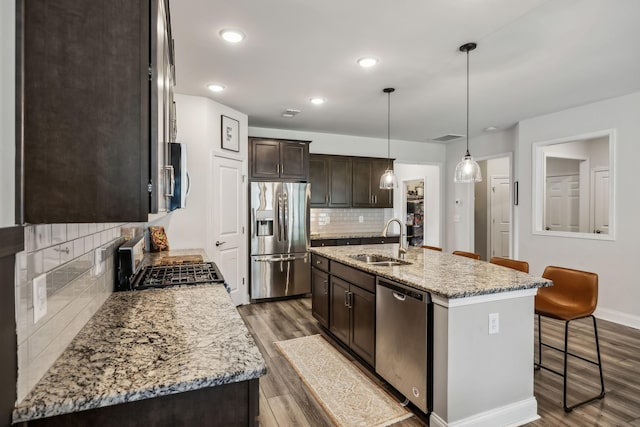 321 Union Pier Dr, Mount Juliet, TN 37122 - kitchen featuring stainless steel appliances, a sink, dark brown cabinets, backsplash, and dark wood-type flooring