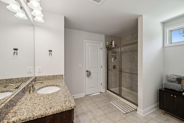 321 Union Pier Dr, Mount Juliet, TN 37122 - full bathroom with a stall shower, double vanity, baseboards, and a chandelier