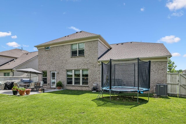 321 Union Pier Dr, Mount Juliet, TN 37122 - rear view of house with a trampoline, central AC, brick siding, and a patio area