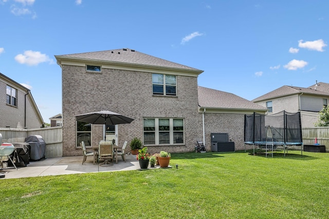 321 Union Pier Dr, Mount Juliet, TN 37122 - rear view of property featuring a patio area, brick siding, a trampoline, and a shingled roof