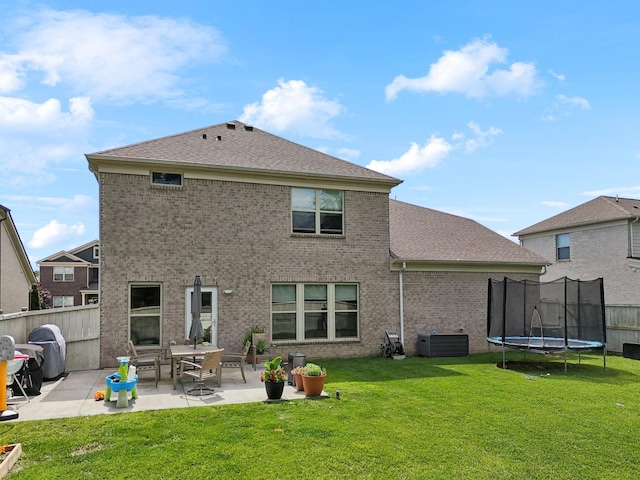 321 Union Pier Dr, Mount Juliet, TN 37122 - rear view of property with a patio area, a trampoline, brick siding, and a shingled roof