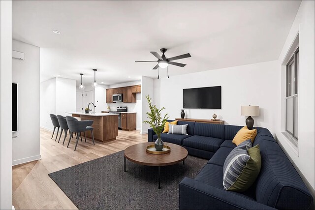 27 Sevier St, Clarksville, TN 37042 - living room featuring light wood-type flooring, baseboards, recessed lighting, and ceiling fan