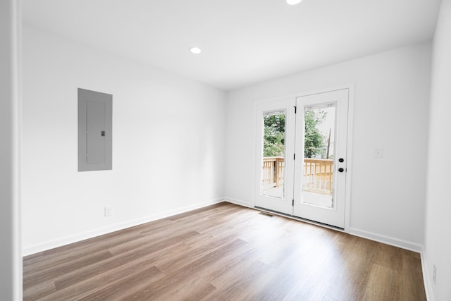 27 Sevier St, Clarksville, TN 37042 - unfurnished room with electric panel, wood finished floors, baseboards, and recessed lighting