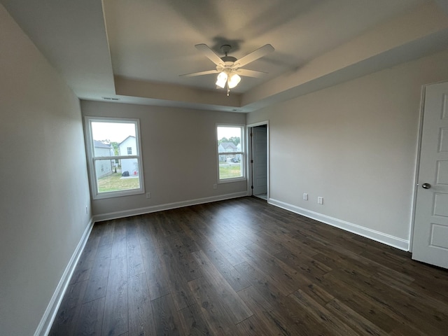 53 Charleston Cv, Clarksville, TN 37043 - spare room with a raised ceiling, ceiling fan, and dark wood-style floors