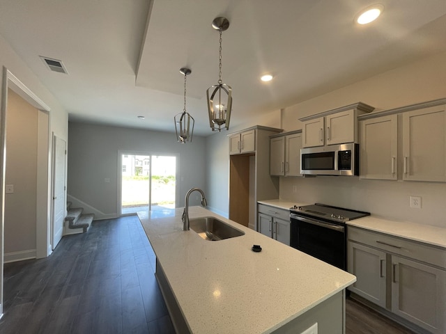 54 Charleston Cv, Clarksville, TN 37043 - kitchen with gray cabinets, appliances with stainless steel finishes, a kitchen island with sink, recessed lighting, and dark wood-style flooring