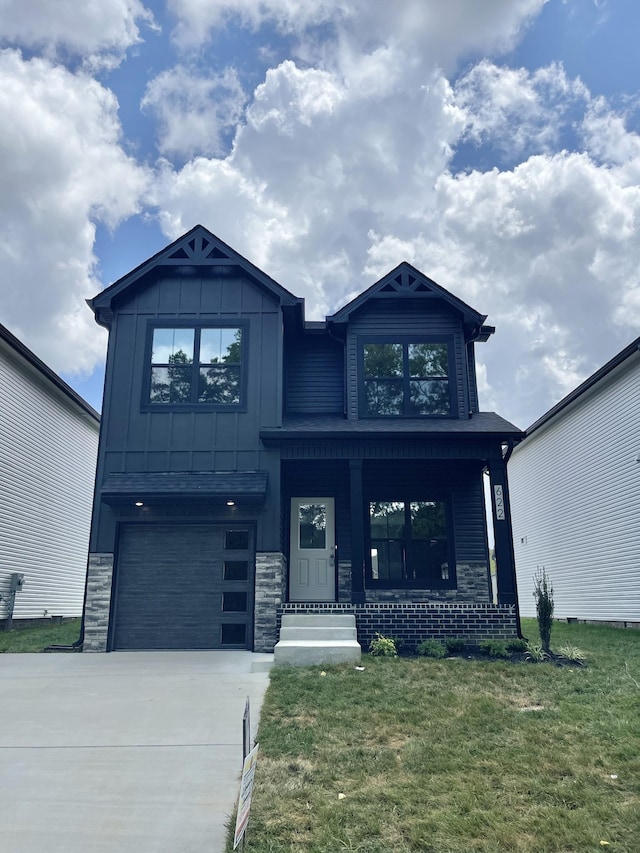 54 Charleston Cv, Clarksville, TN 37043 - craftsman inspired home with concrete driveway, a front yard, a garage, covered porch, and board and batten siding