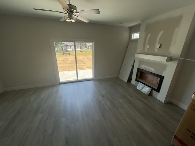 56 Charleston Cv, Clarksville, TN 37043 - unfurnished living room with a glass covered fireplace, healthy amount of natural light, and wood finished floors
